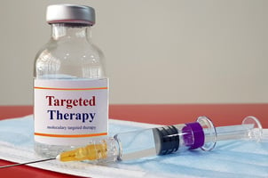 syringe with vial labeled "targeted therapy"