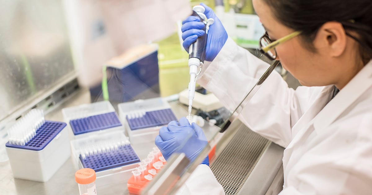 Scientist with pipette and samples